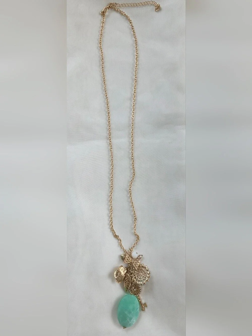 Gold Tone Charm Pendant Necklace with Turquoise Stone